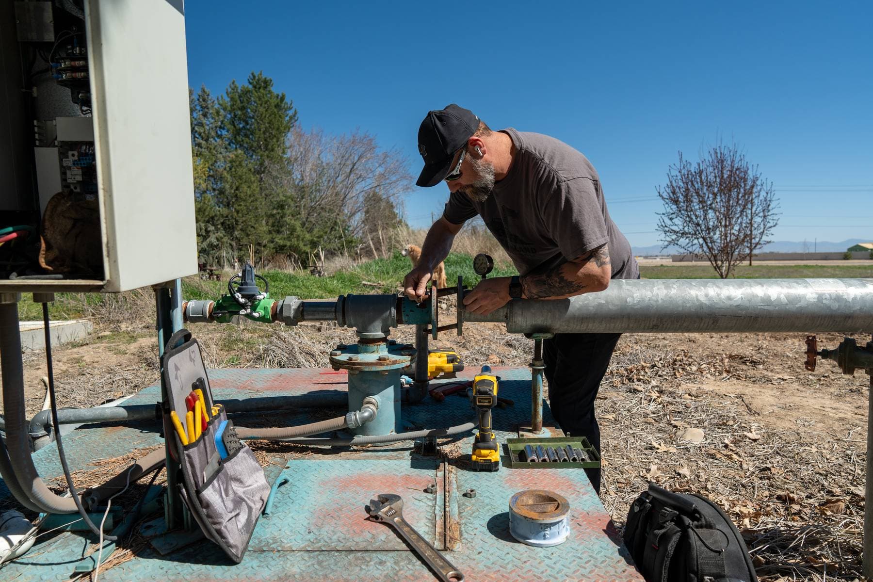 Technicians discussing pump system work.