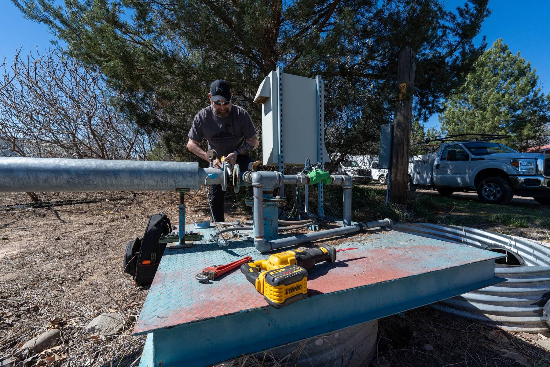 Field technician at a pump service site.